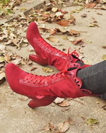 Bottes mi-mollet à lacets et talons hauts à bords creux