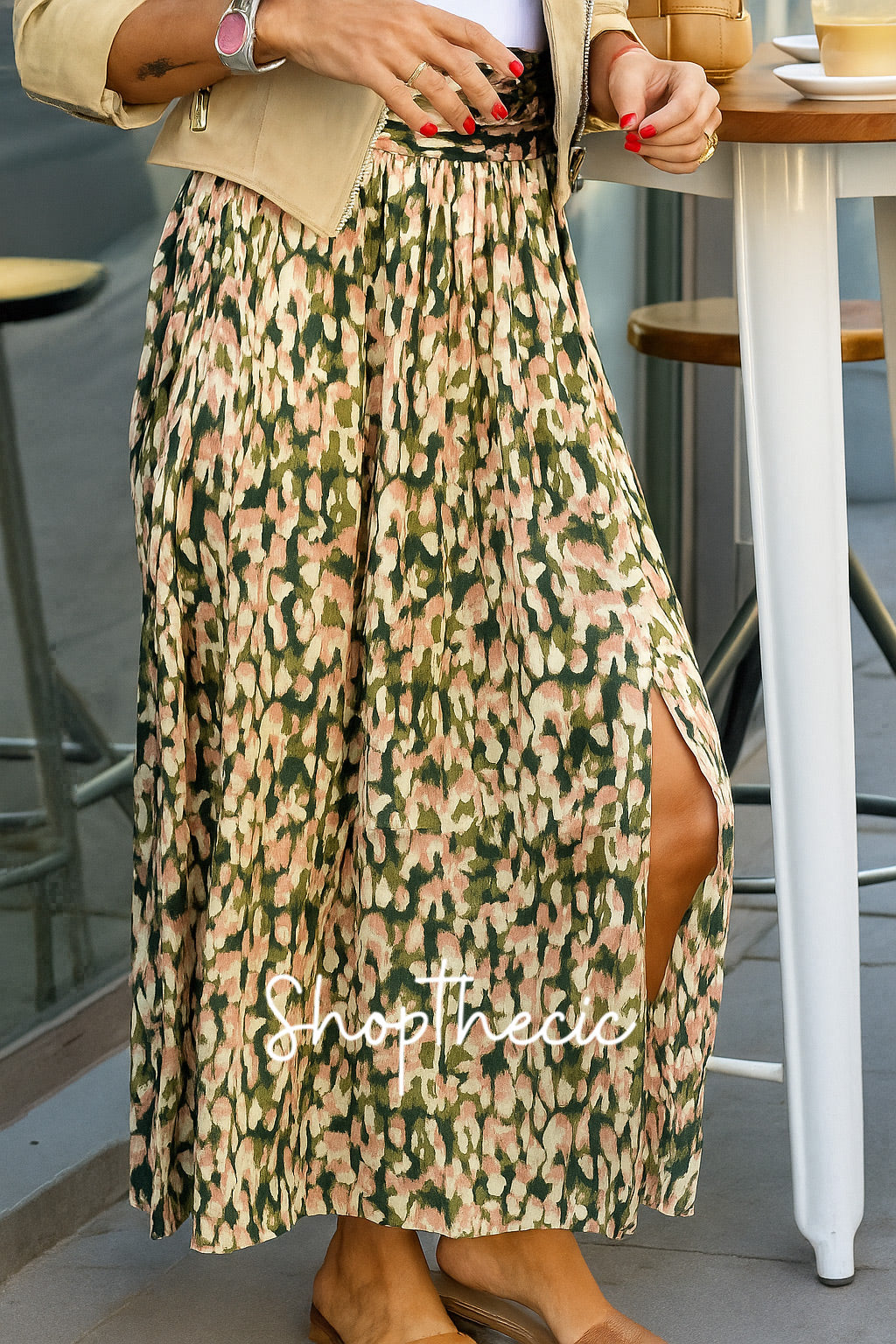 Suede motorcycle jacket and printed pleated skirt two-piece set