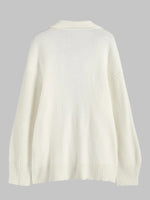 Cardigan long à double poche ouvert sur le devant, manches lanternes, épaules tombantes et revers