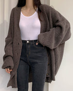 Cardigan tricoté à manches lanternes amples à simple boutonnage et col en V