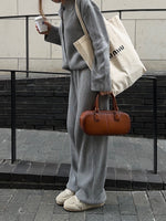 Set aus einreihiger Rippstrickjacke mit Revers und lockerer Hose