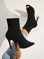 Neo-Noir Stiletto open-toe knitted sock boots