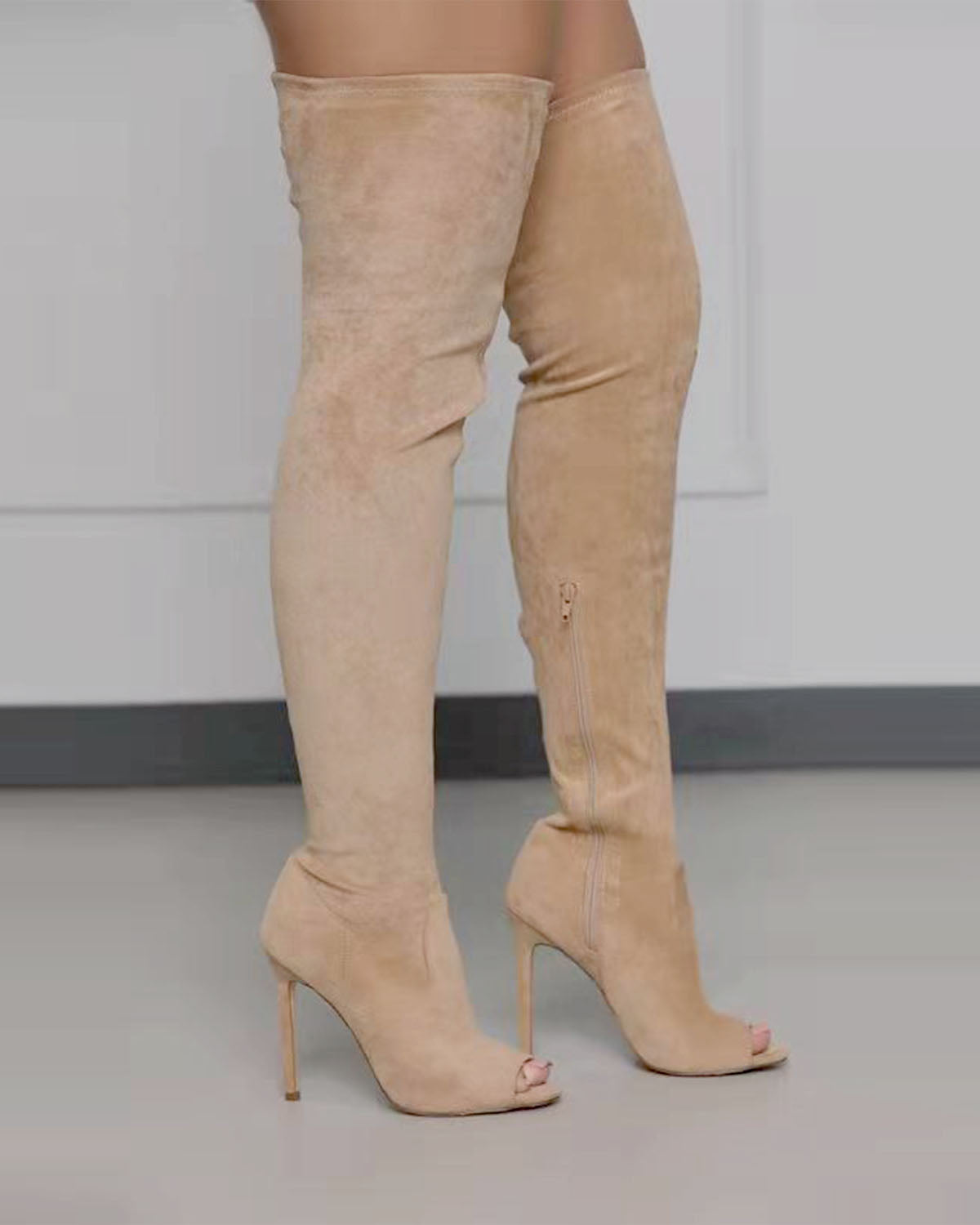 Bottes extensibles à talons hauts et fermeture éclair latérale au-dessus du genou