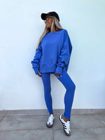 Loose long-sleeved round neck slit top and tight pants two-piece set