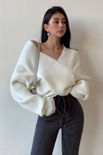 Off-the-shoulder cross-over asymmetrical cropped sweater
