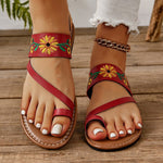 Sandales plates brodées à bride arrière