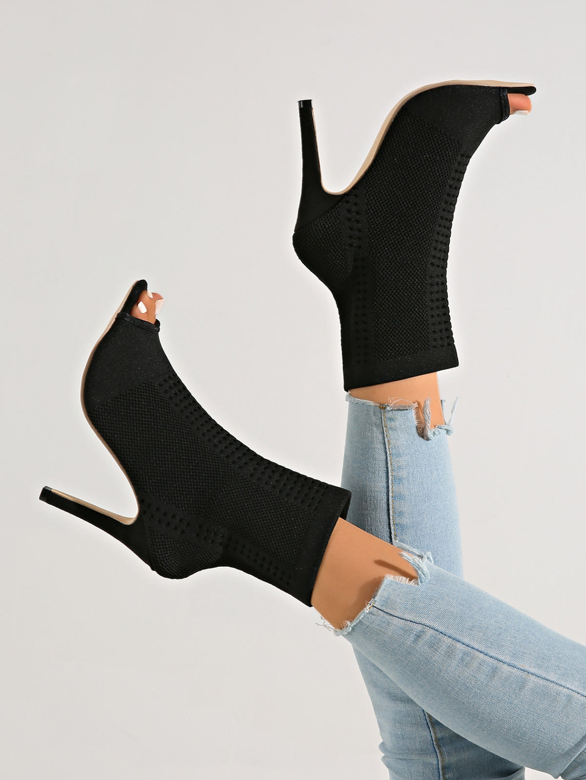 Neo-Noir Stiletto open-toe knitted sock boots