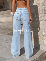 Distressed high-waisted frayed wide-leg jeans