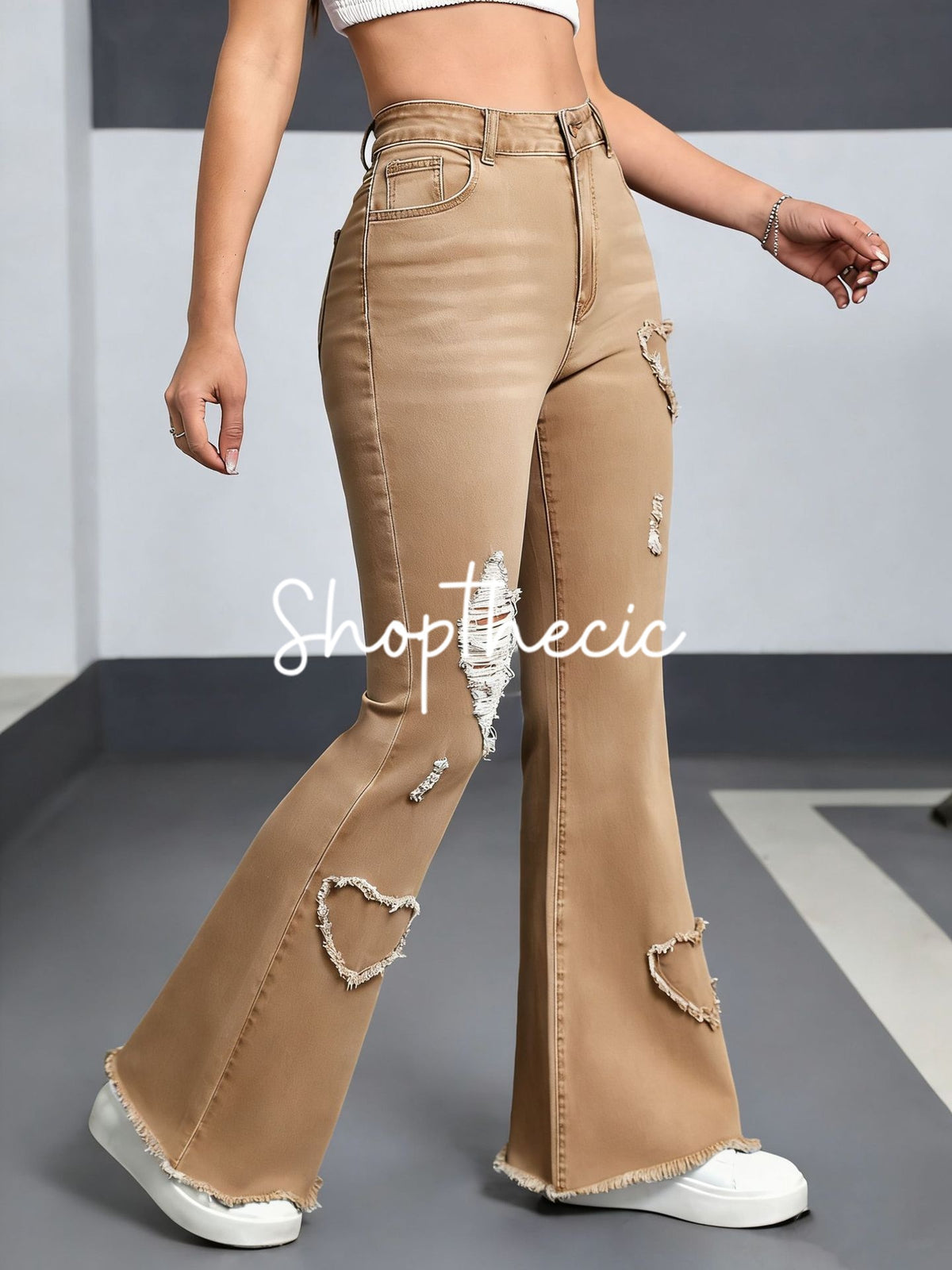 Heart-patterned ripped stretch flared jeans