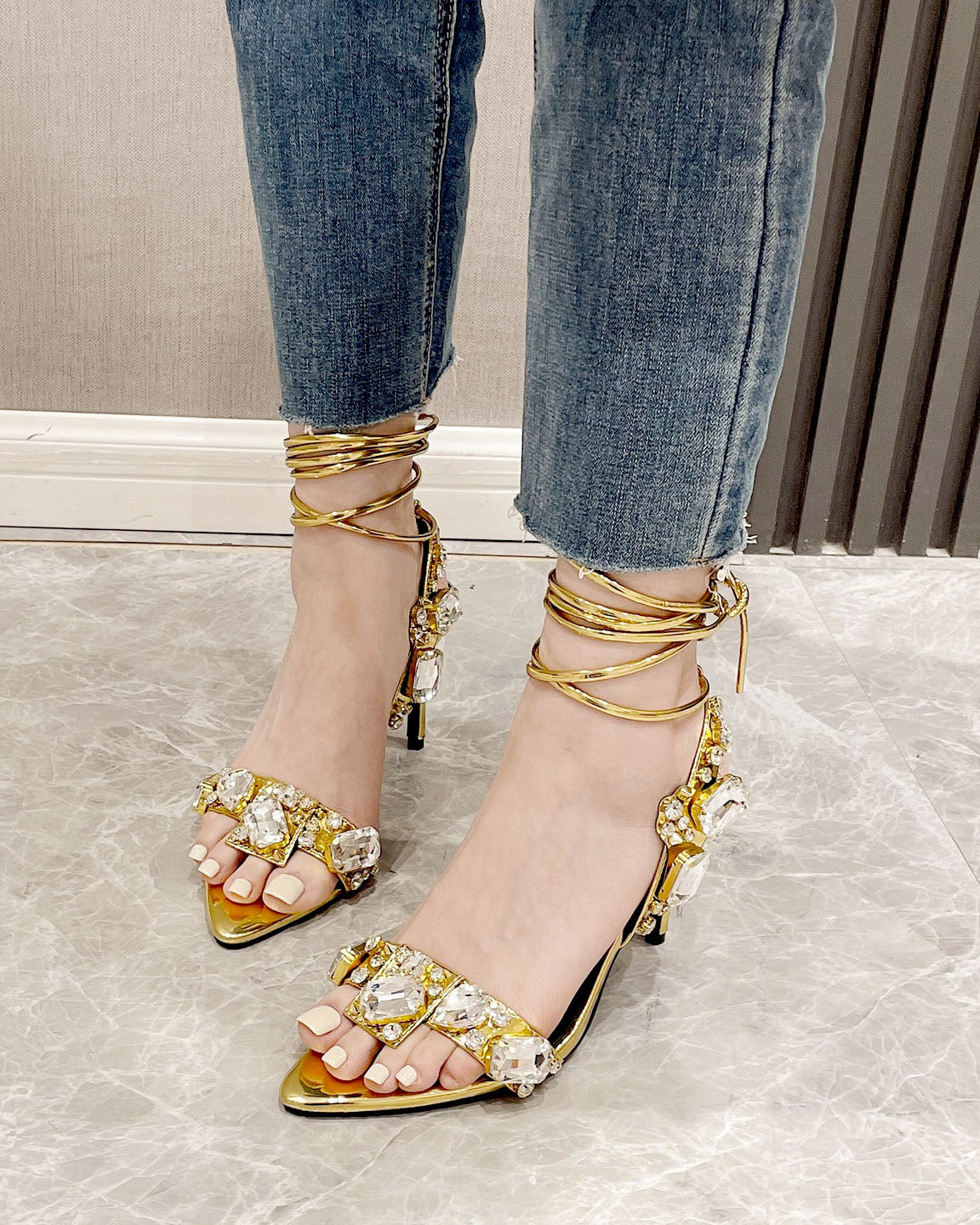 Luxurious rhinestone-encrusted wraparound strappy stiletto sandals