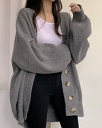 Cardigan tricoté à manches lanternes amples à simple boutonnage et col en V