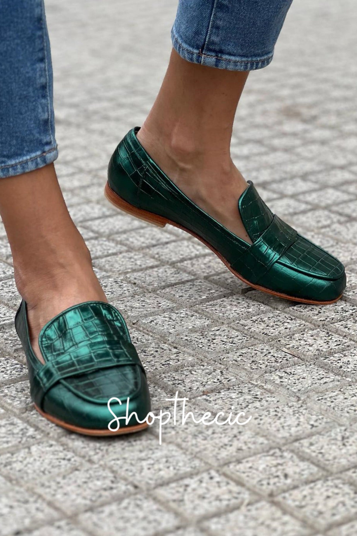 Emerald green stone-embossed flat slip-on loafers