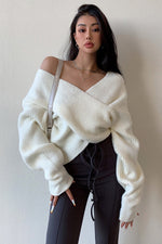 Off-the-shoulder cross-over asymmetrical cropped sweater