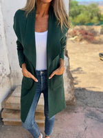 Strickjacke aus Wolle mit langem Revers und einfarbiger Tasche