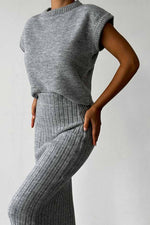 Sleeveless knitted pullover top and fitted long skirt two-piece set