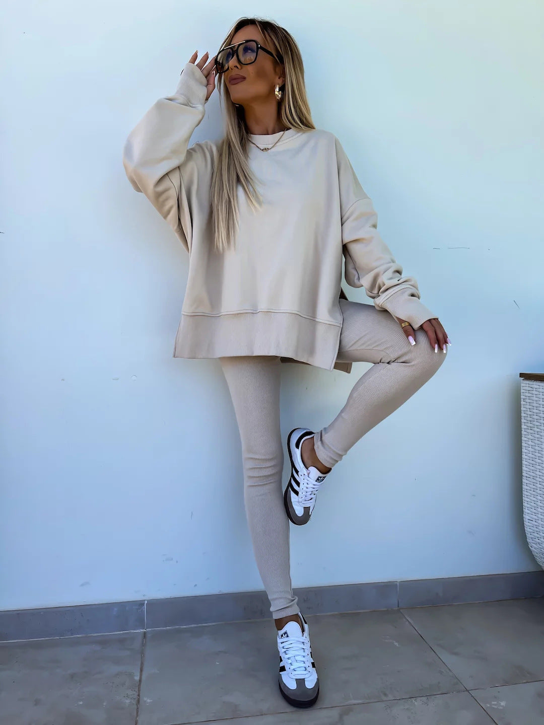 Loose long-sleeved round neck slit top and tight pants two-piece set