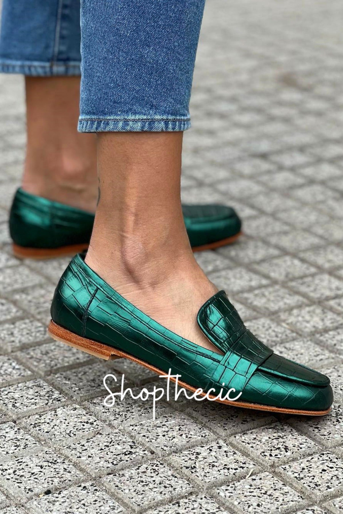 Emerald green stone-embossed flat slip-on loafers