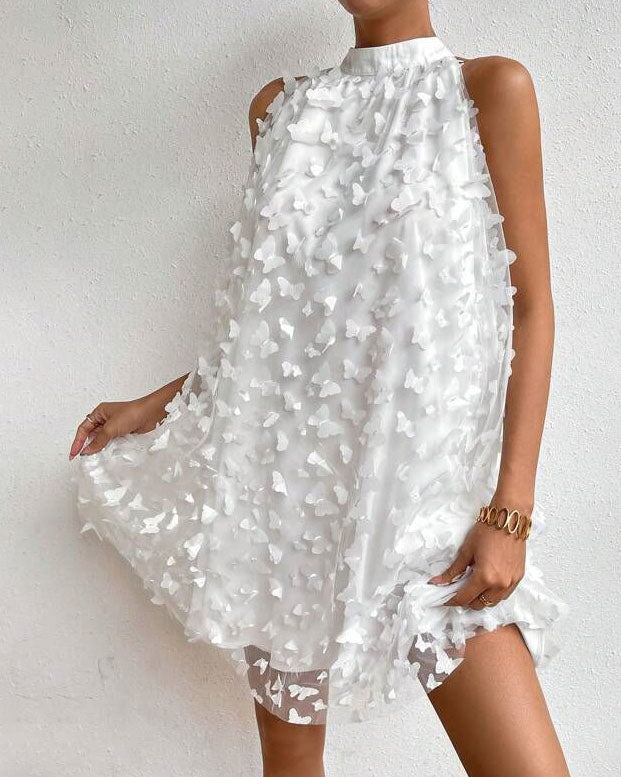 Mini-robe dos nu en maille avec appliques florales