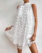 Mini-robe dos nu en maille avec appliques florales