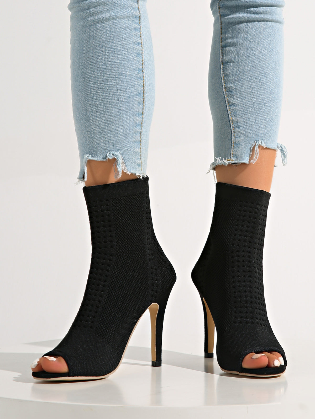 Neo-Noir Stiletto open-toe knitted sock boots