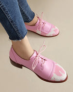 Round toe low-cut suede-trimmed cow-print loafers