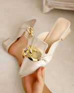 Pointed toe metal buckle flat mules