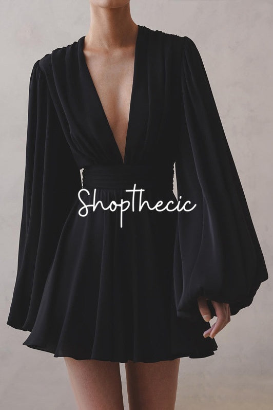 Black puff-sleeve deep V-neck high-waisted dress