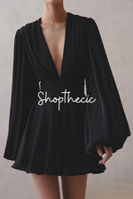 Black puff-sleeve deep V-neck high-waisted dress