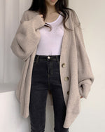 Cardigan tricoté à manches lanternes amples à simple boutonnage et col en V