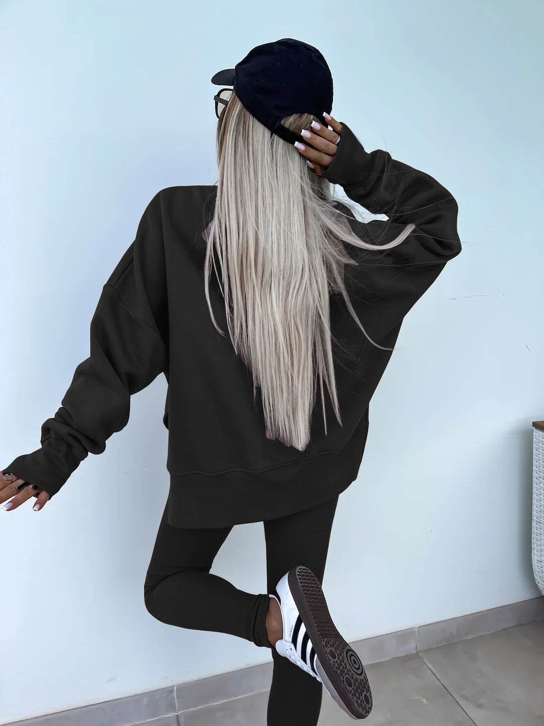 Loose long-sleeved round neck slit top and tight pants two-piece set