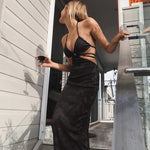 Robe midi moulante en tricot dos nu à bandes