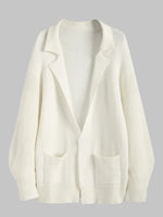 Cardigan long à double poche ouvert sur le devant, manches lanternes, épaules tombantes et revers