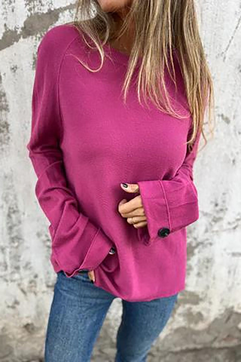 Blusa solta de cor sólida com mangas compridas e punhos abotoados