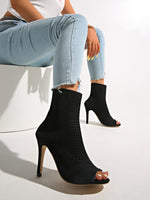 Neo-Noir Stiletto open-toe knitted sock boots