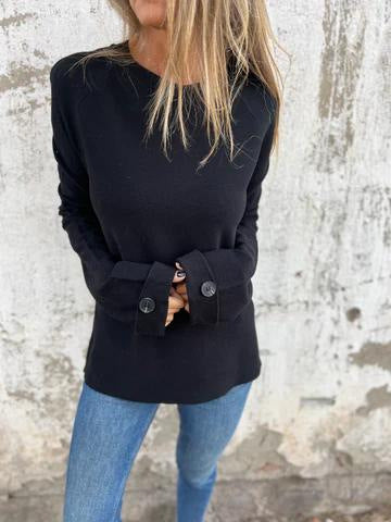 Blusa solta de cor sólida com mangas compridas e punhos abotoados