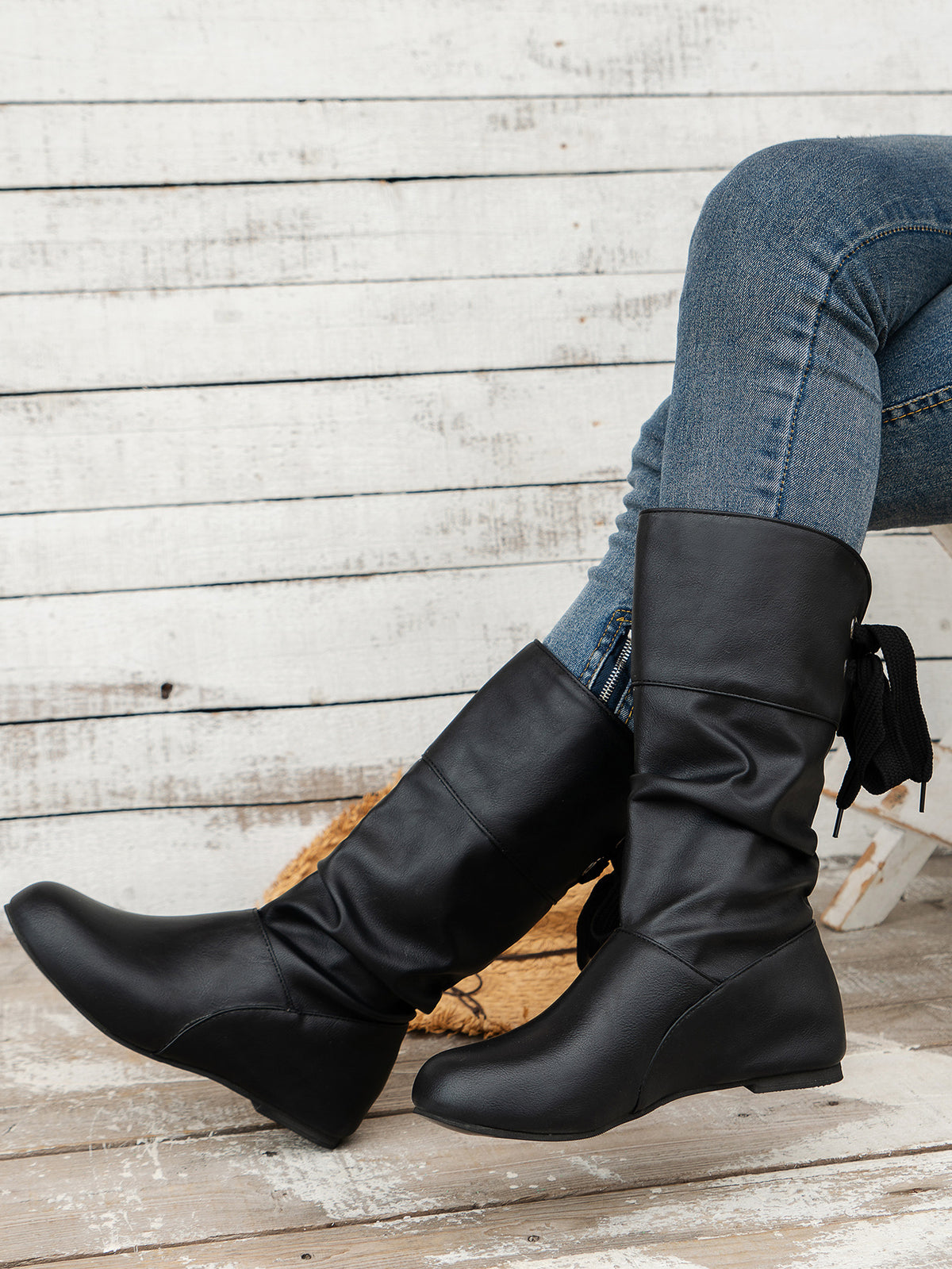 Bottines mi-mollet à bout rond et nœud arrière