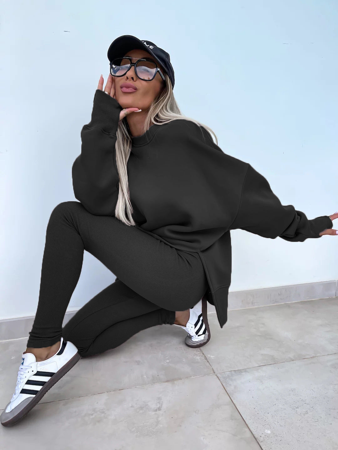 Loose long-sleeved round neck slit top and tight pants two-piece set