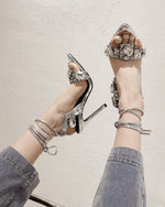 Luxurious rhinestone-encrusted wraparound strappy stiletto sandals