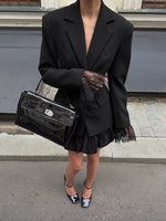 Schwarzer langärmliger Spitzen-Patchwork-Taillenanzug