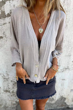 Low-cut V-neck button-down cotton and linen shirt