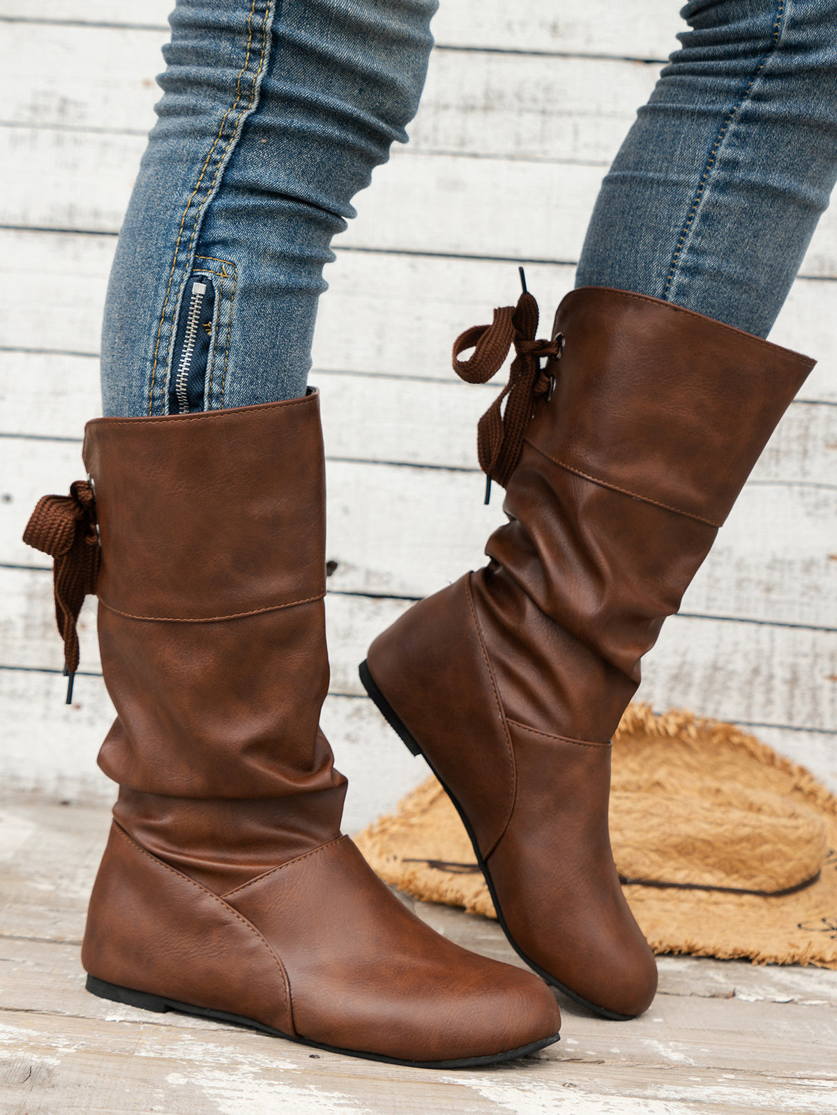Bottines mi-mollet à bout rond et nœud arrière