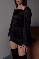 Long sleeved square neck halter back black dress