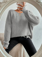 Solid color round neck ripped design loose knit sweater