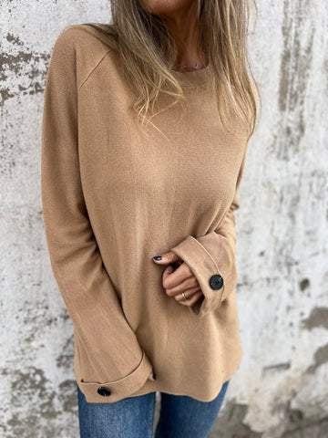 Blusa solta de cor sólida com mangas compridas e punhos abotoados