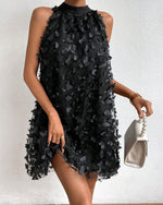 Mini-robe dos nu en maille avec appliques florales