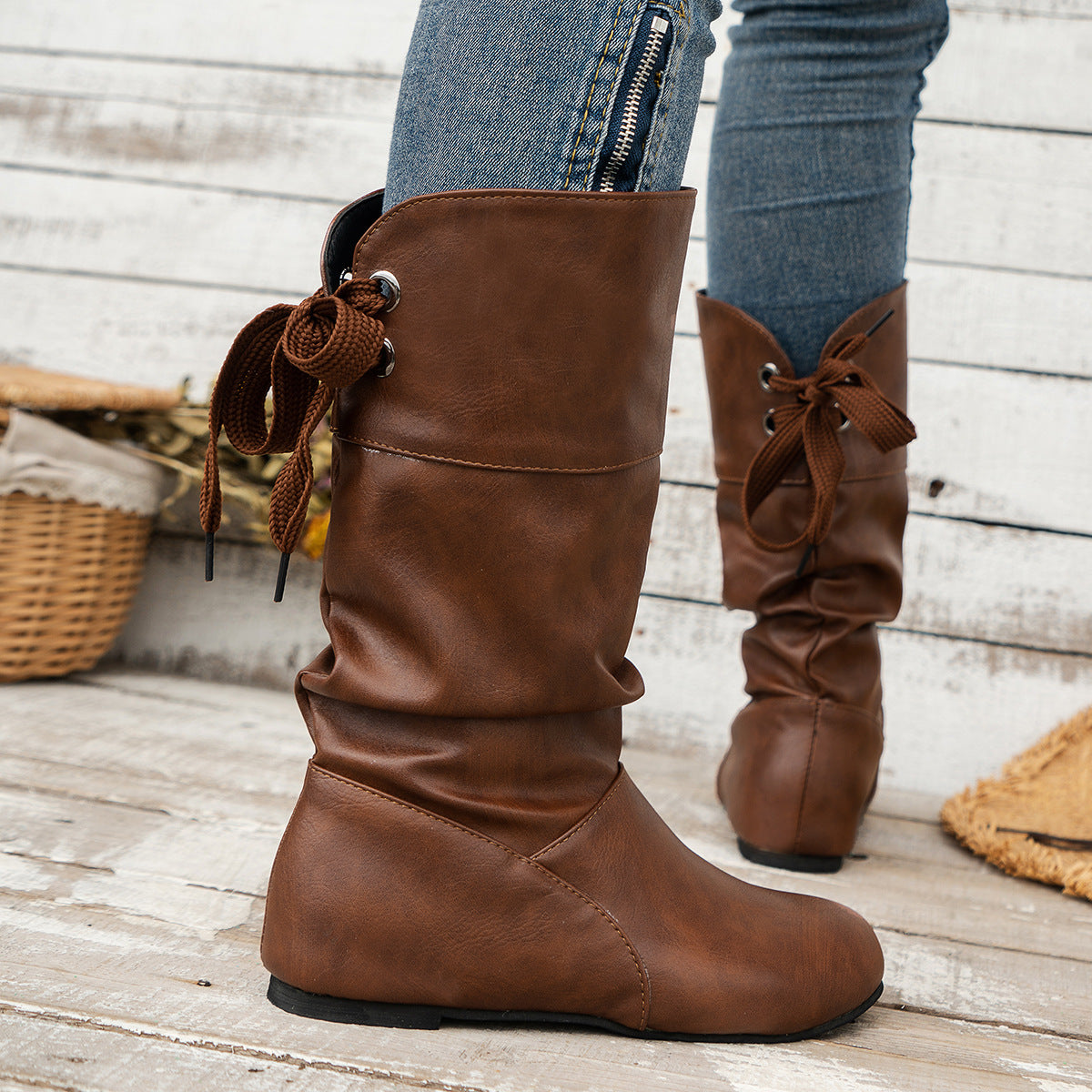 Bottines mi-mollet à bout rond et nœud arrière