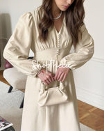 Elegante abito da sera a trapezio con scollo a V