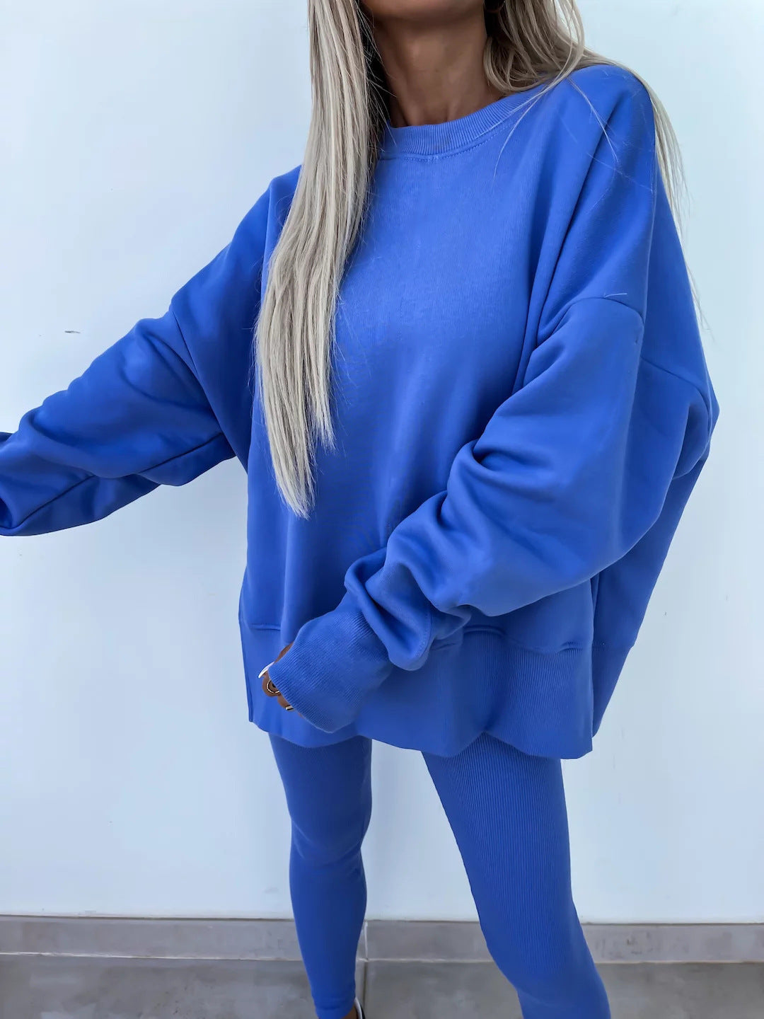 Loose long-sleeved round neck slit top and tight pants two-piece set