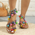 Sandales plates bohème à pompons et brides croisées