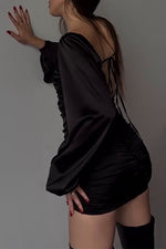 Long sleeved square neck halter back black dress